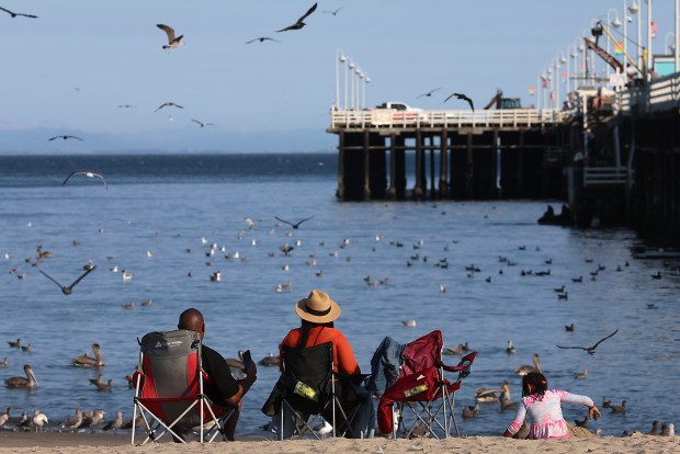 One family on Main Beach has front row seats to...